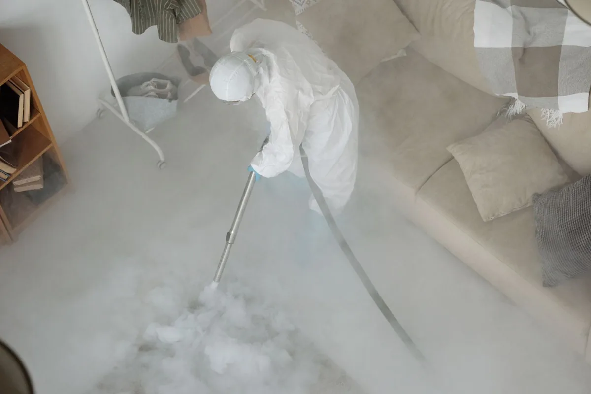 Biohazard cleanup technician in protective equipment, Archer City, TX